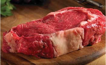 Raw bison rib eye steak